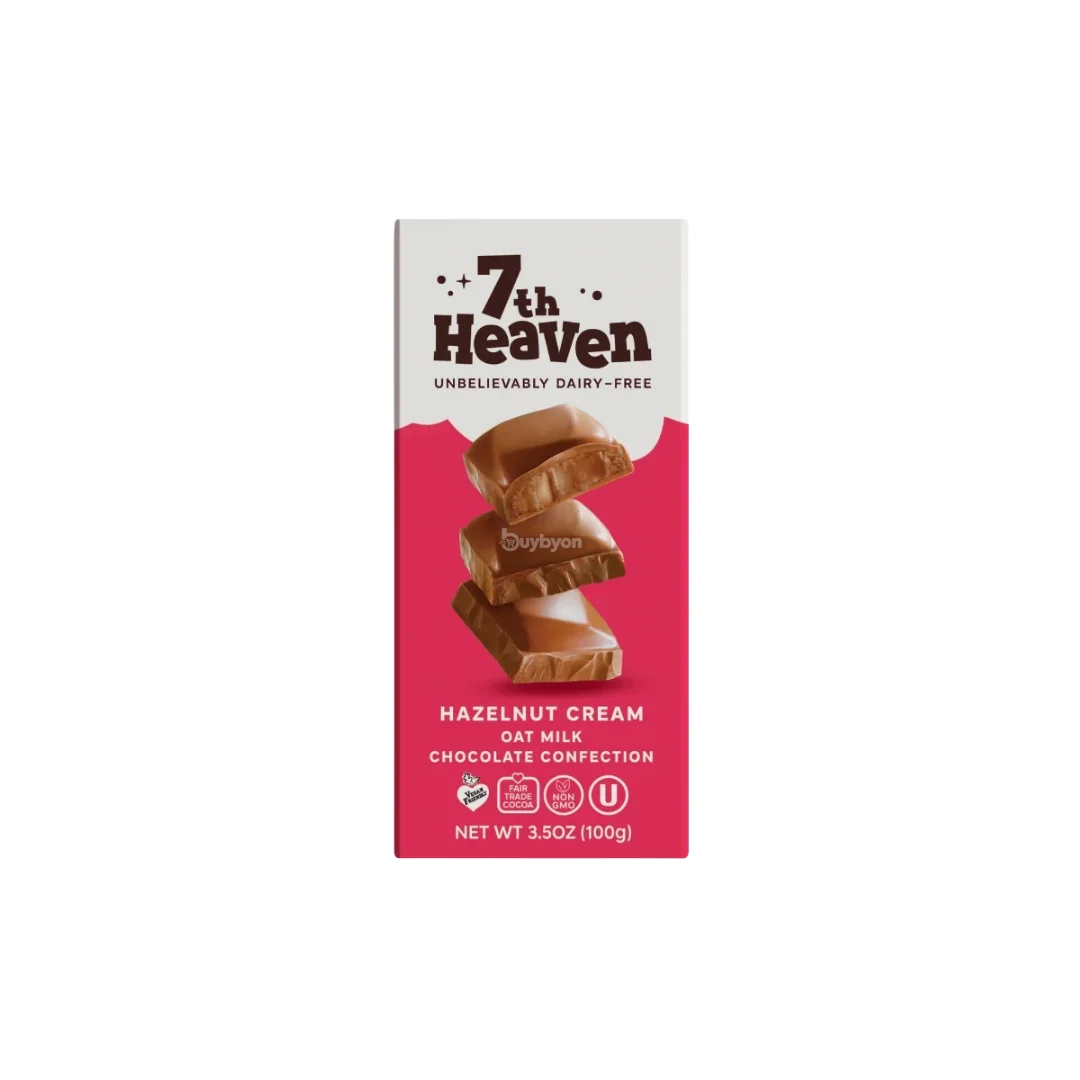 A boxed chocolate confection product on a plain white background. The package is tall and narrow, with a white top section, dark brown '7th Heaven' branding, and a bright pink lower section showing stacked chocolate pieces.