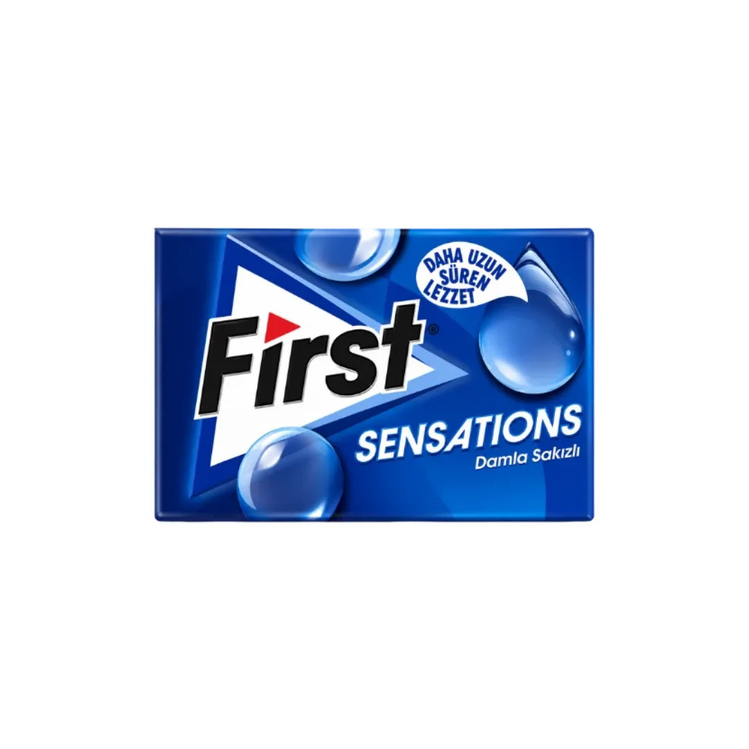 A rectangular blue package of First Sensations Damla Sakızı gummi on a plain white background.