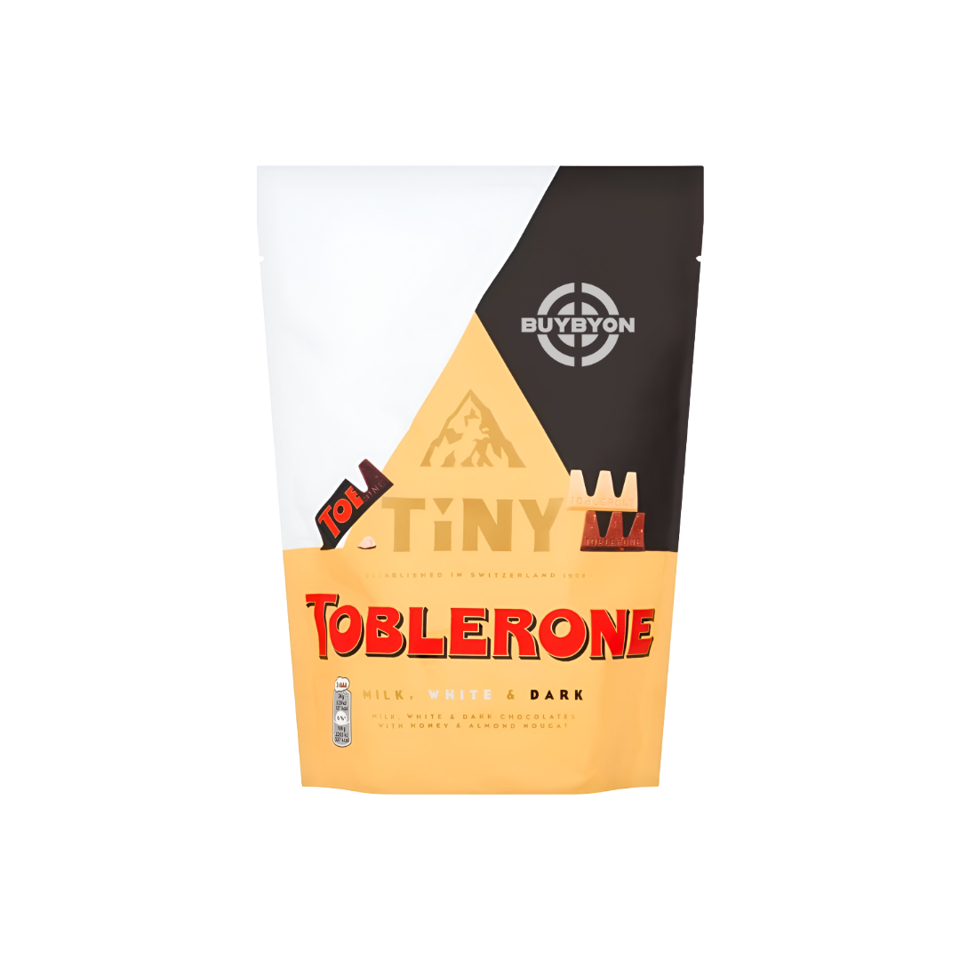 Toblerone Milk, White & Dark Pouch - 280g featuring a mix of milk, white, and dark chocolate triangular pieces with honey and almond nougat.